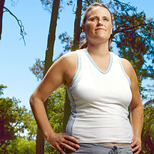 Woman looking focused, hands on hips